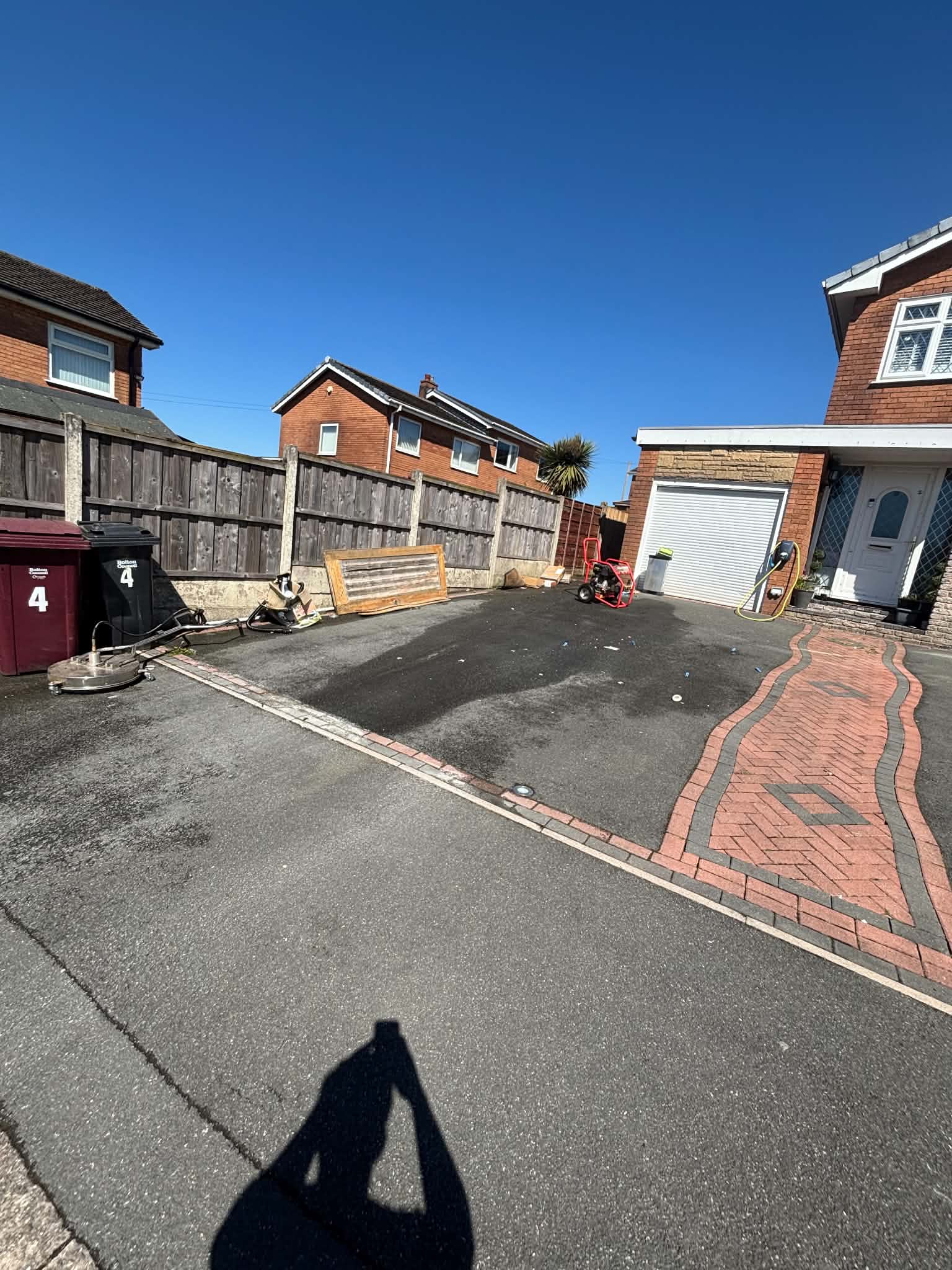 Driveway before pressure washing